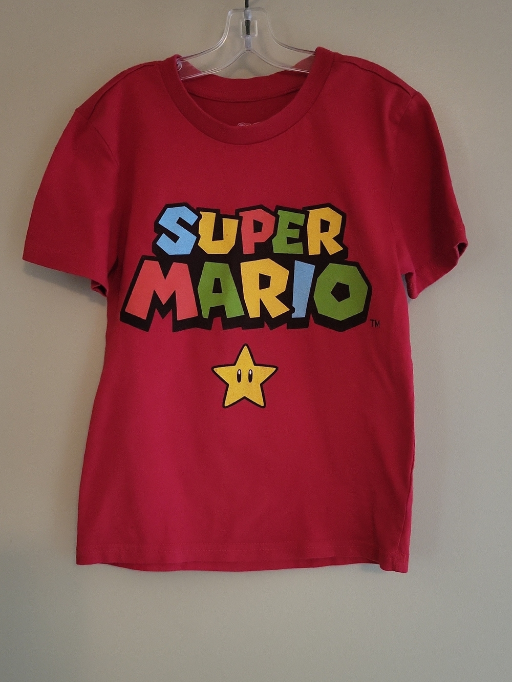 Nintendo Super Mario red tee shirt with colorful graphic on front and back